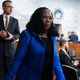 Judge Ketanji Brown Jackson, President Biden’s nominee for Associate Justice to the Supreme Court, arrives on the third day of her Senate Judiciary Committee confirmation hearing in Hart Senate Office Building on Capitol Hill, on Wednesday, March 23, 2022. Her husband Patrick Jackson appears at left.